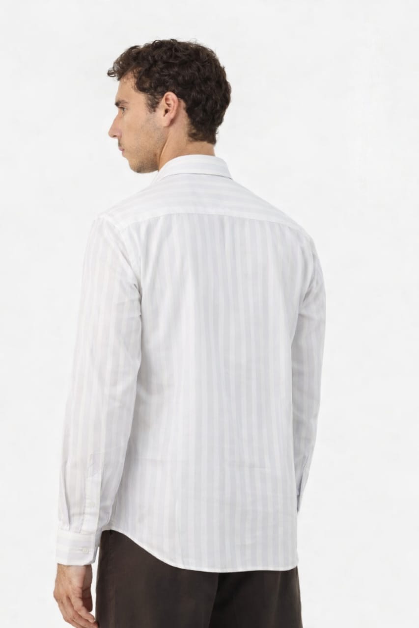 Man wearing a white striped shirt on a white background