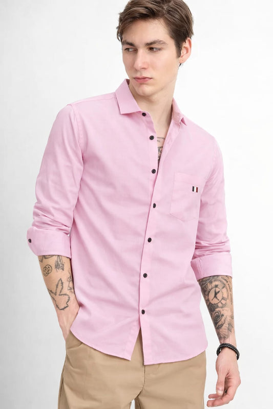 Man wearing a pink shirt with a white background