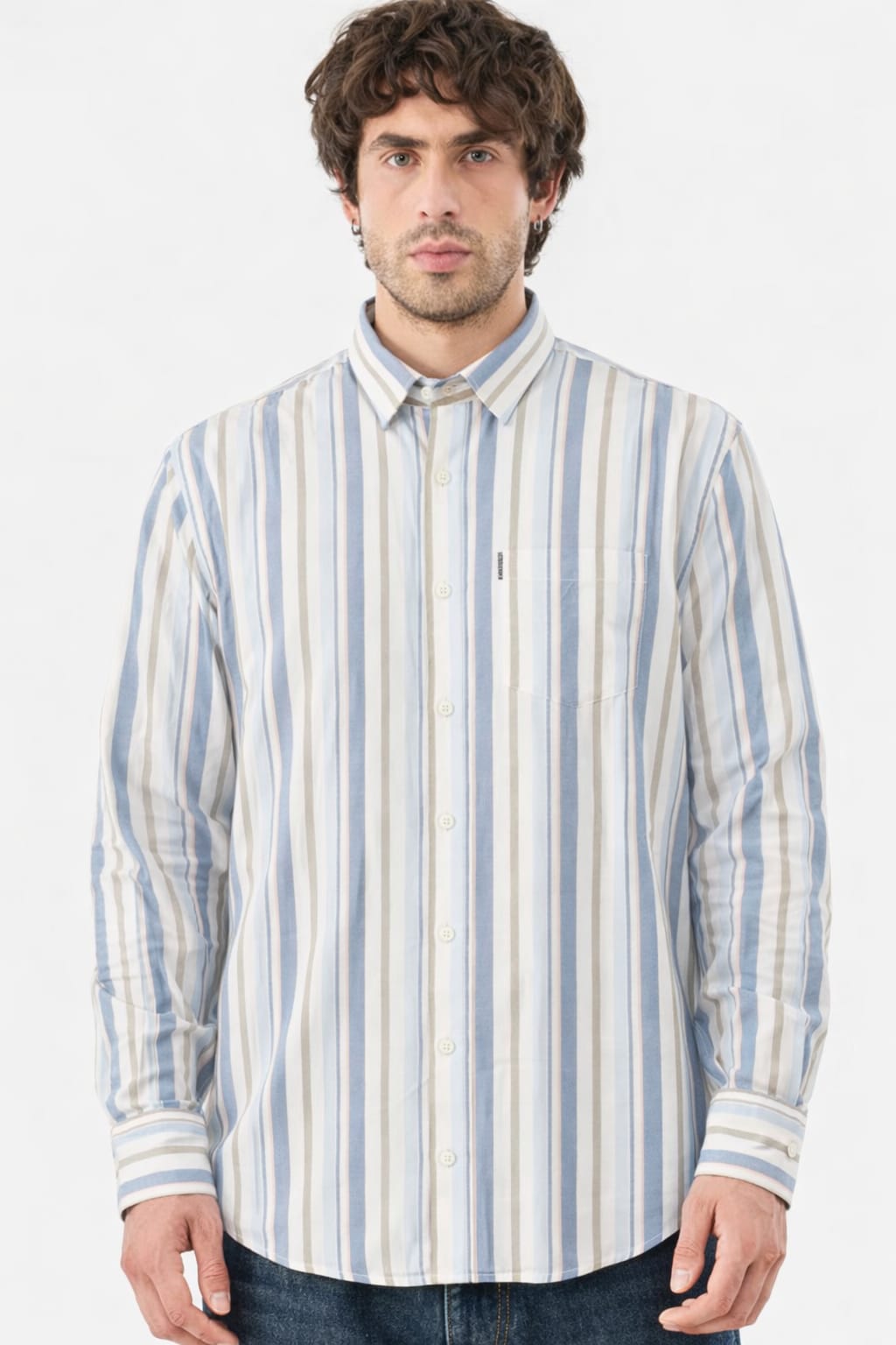 Man wearing a striped shirt with a plain background
