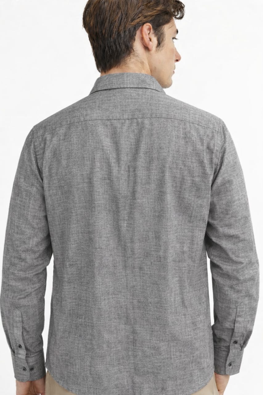 Man wearing a gray checkered shirt on a white background