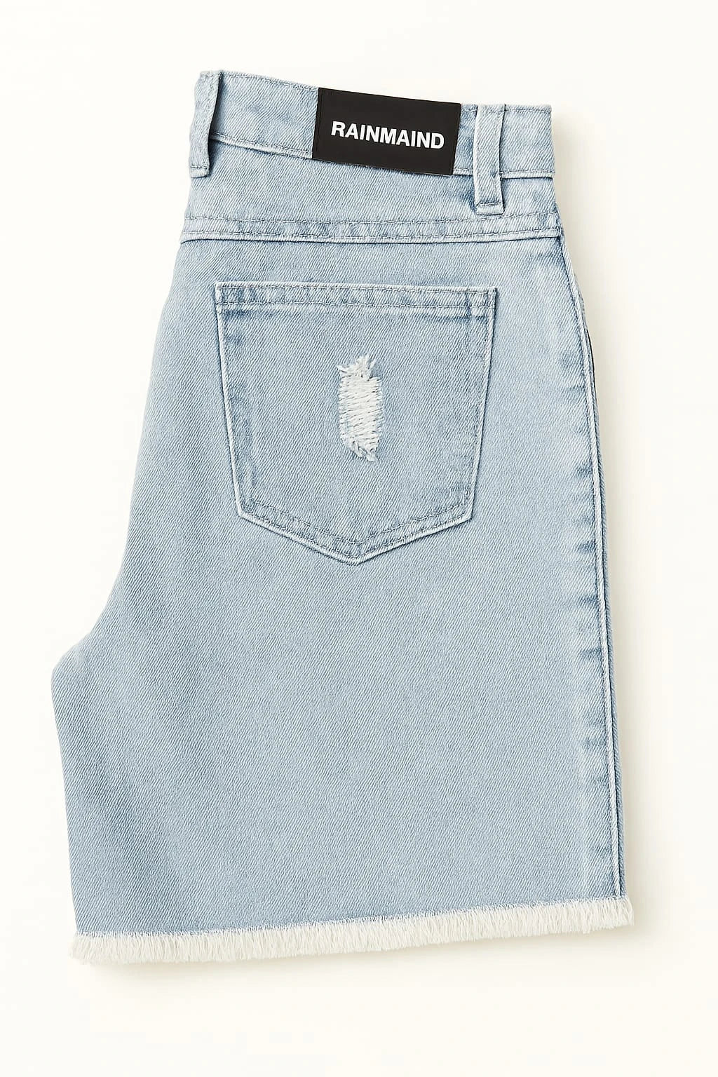 Light blue denim skirt with a frayed hem on a white background