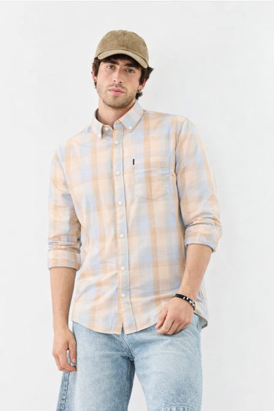 Man wearing a plaid shirt and cap on a white background