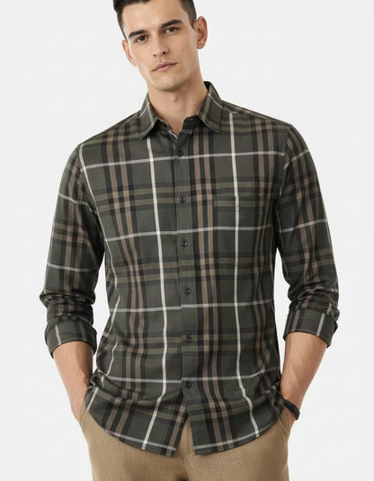 Man wearing a plaid shirt on a white background