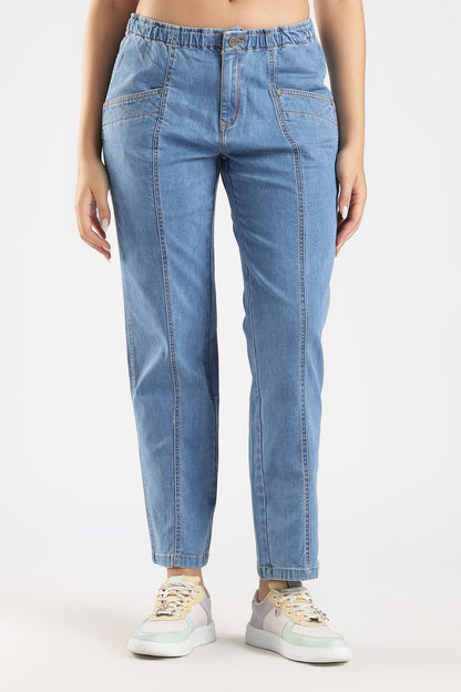 Light blue jeans worn by a person on a white background
