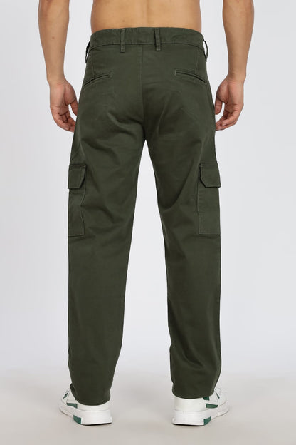 Green cargo pants worn by a person on a white background