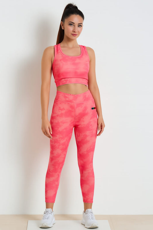 Woman wearing a pink athletic outfit on a white background