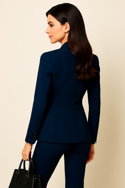 Woman wearing a navy blue suit with a beige background