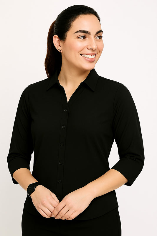 Woman wearing a black shirt against a white background