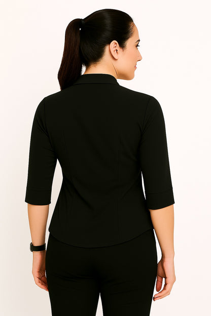 Woman wearing a black blouse with three-quarter sleeves on a white background
