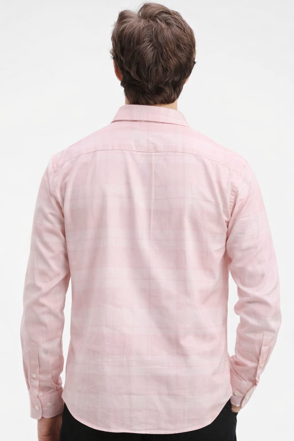 Person wearing a light pink shirt on a white background
