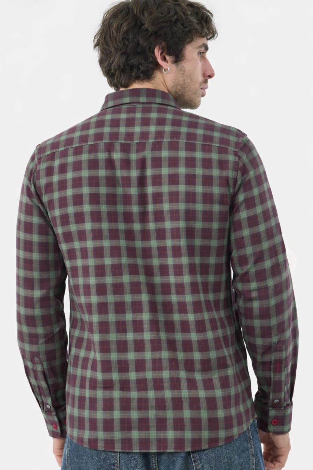 Man wearing a plaid shirt with a white background