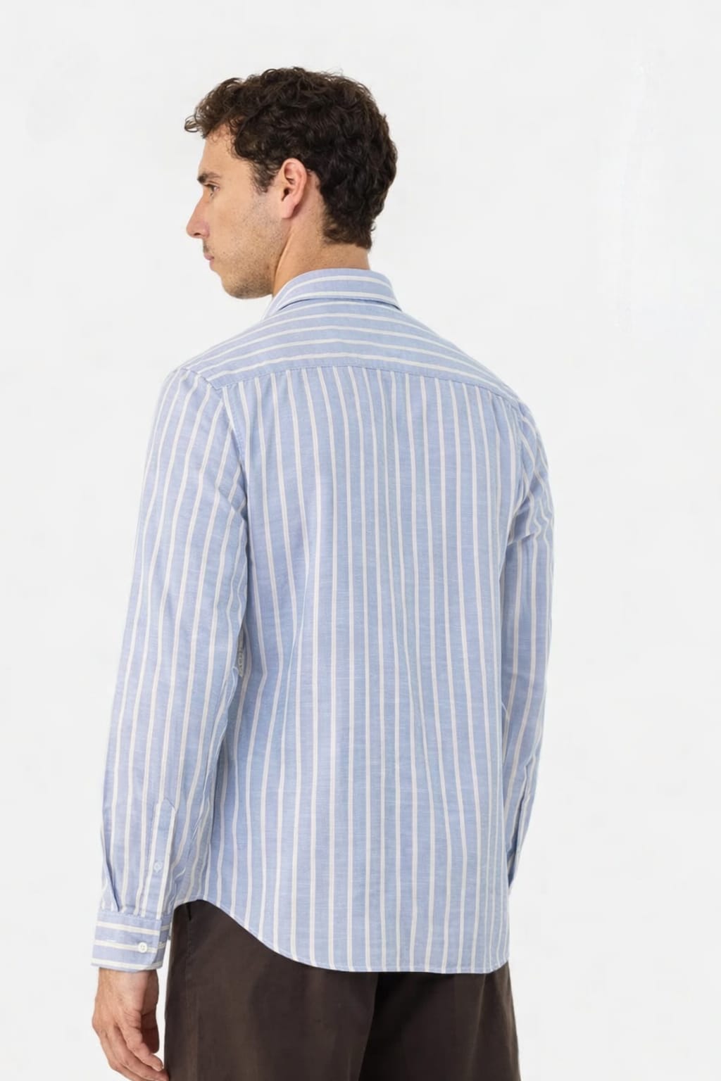 Man wearing a blue striped shirt on a white background