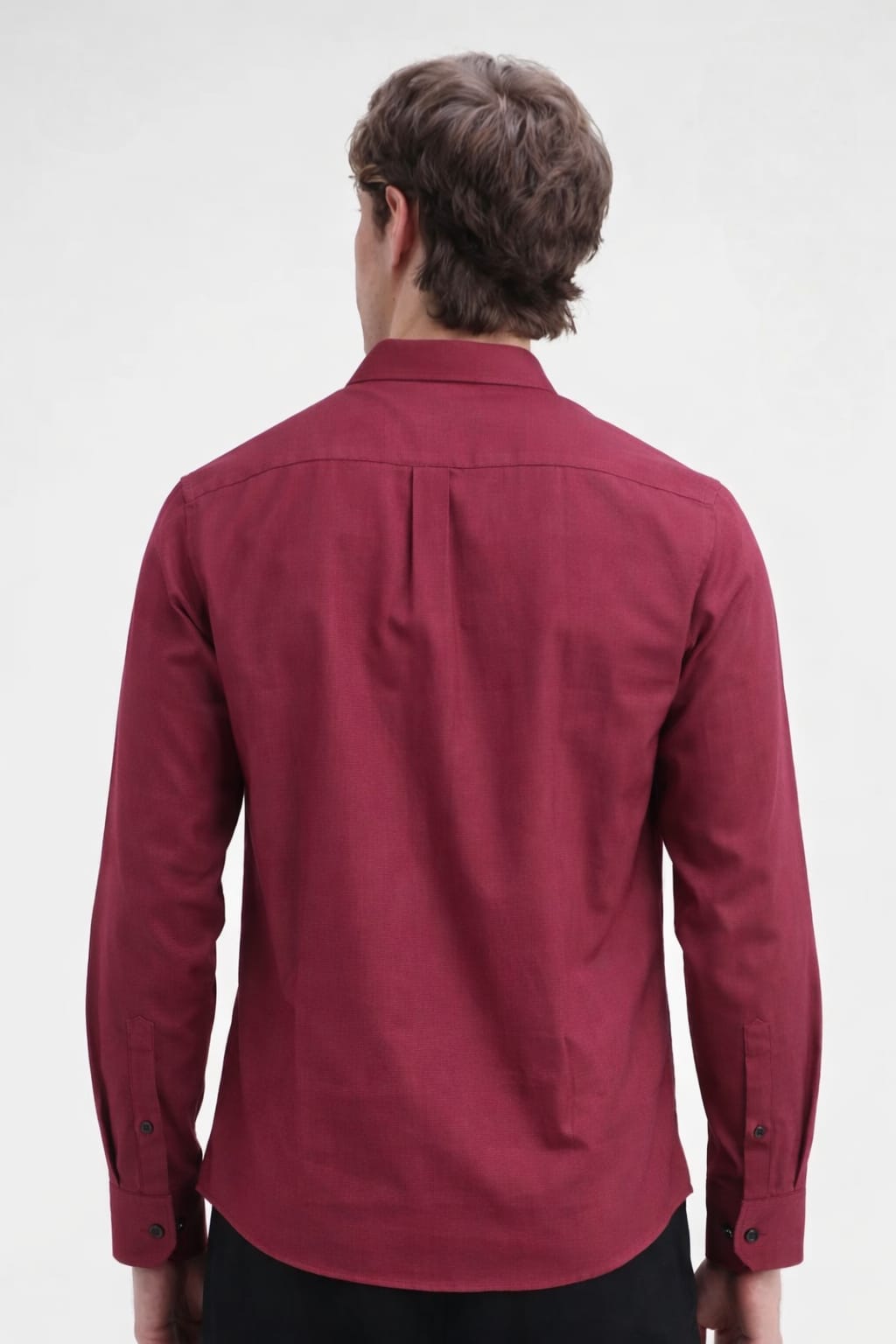 Man wearing a maroon shirt on a white background