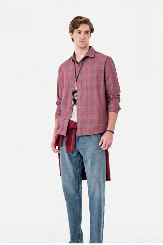 Man wearing a red plaid shirt against a white background