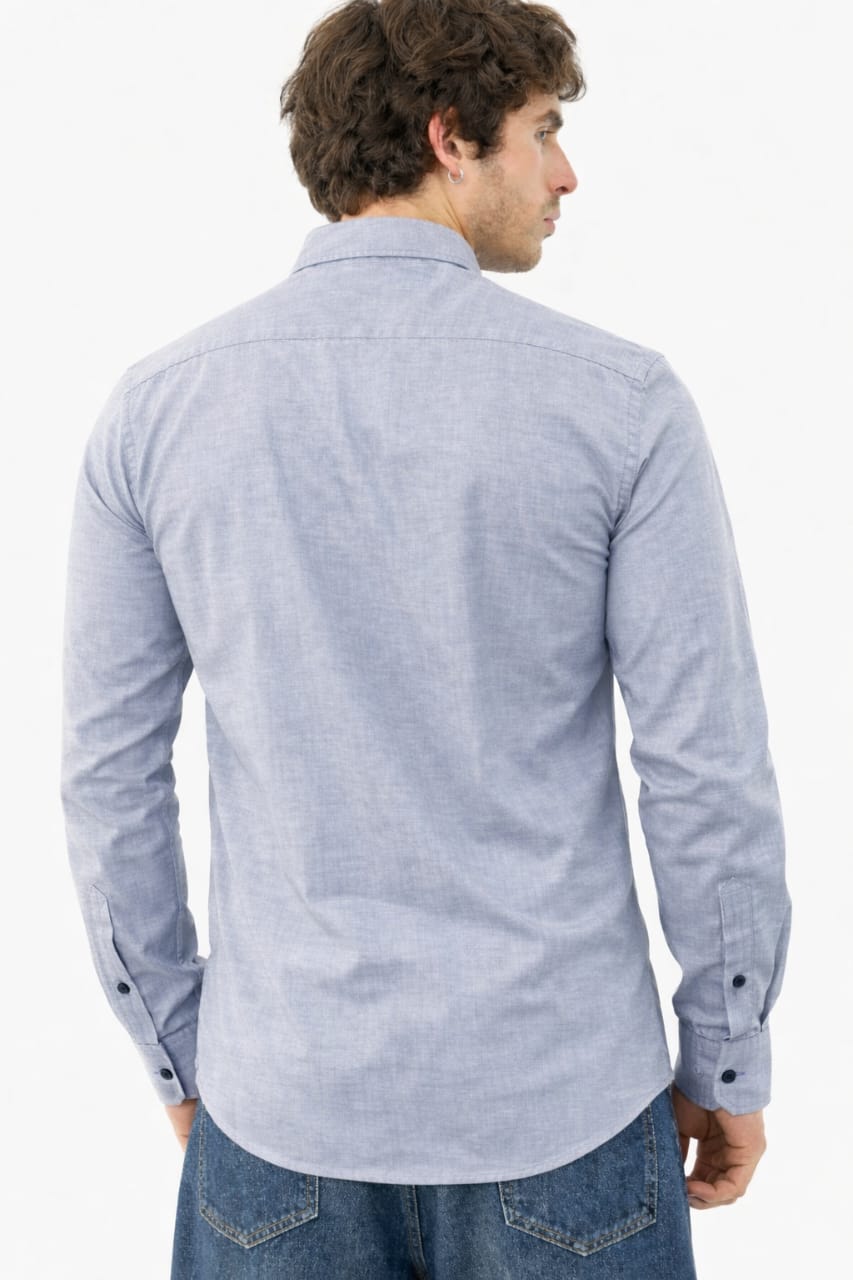 Man wearing a light blue checkered shirt on a white background
