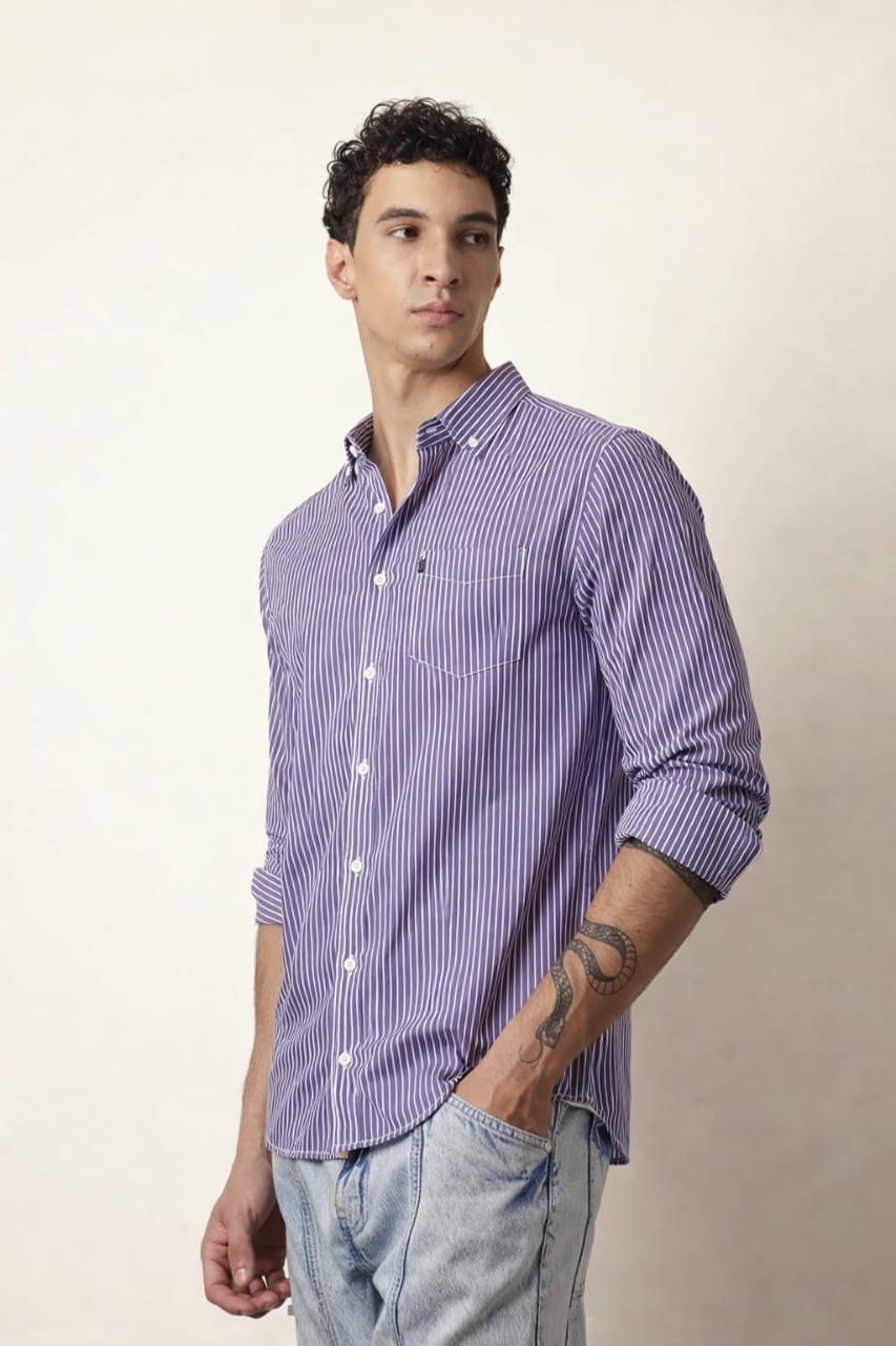 Man wearing a purple striped shirt against a plain background