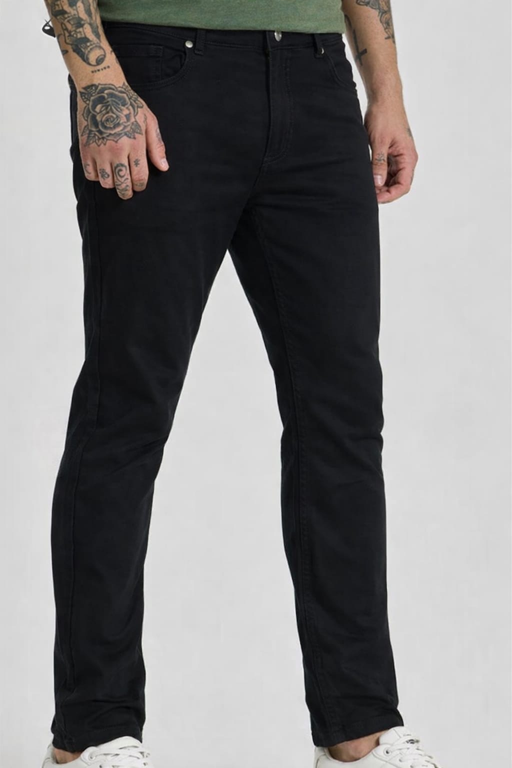 Person wearing black jeans on a white background