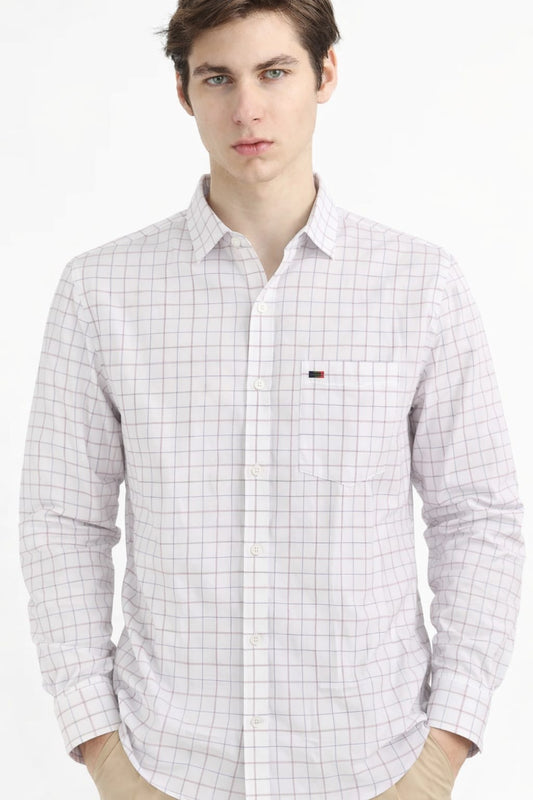 Man wearing a checkered shirt with a brand logo on a white background