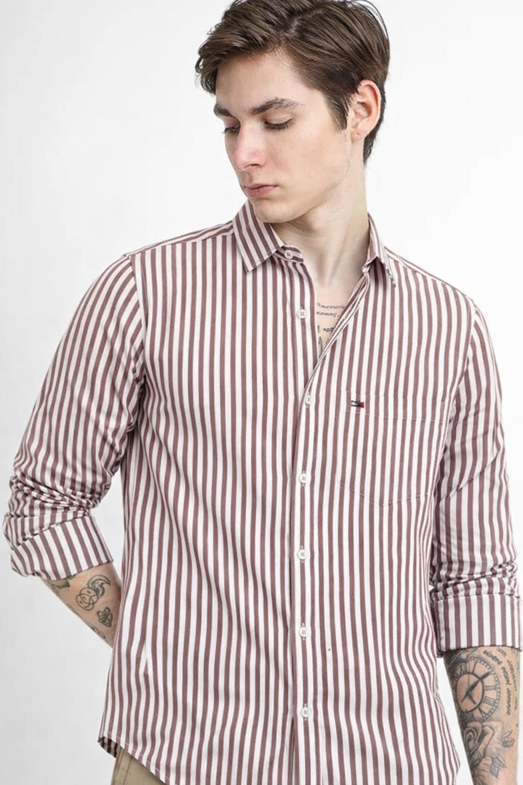 Man wearing a red and white striped shirt on a white background