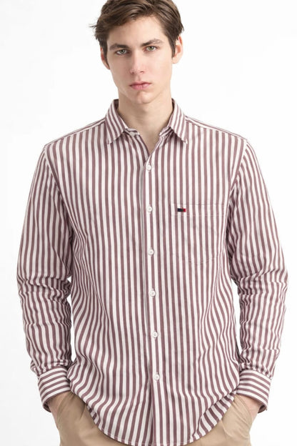 Man wearing a red and white striped shirt on a white background