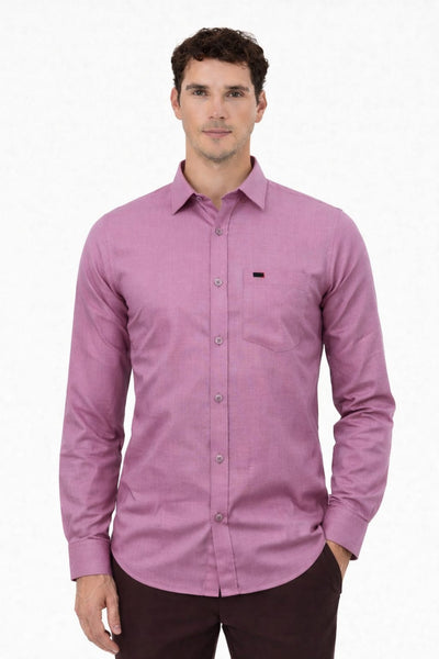 Man wearing a purple button-up shirt on a white background
