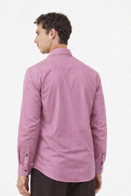 Man wearing a pink shirt from behind on a white background