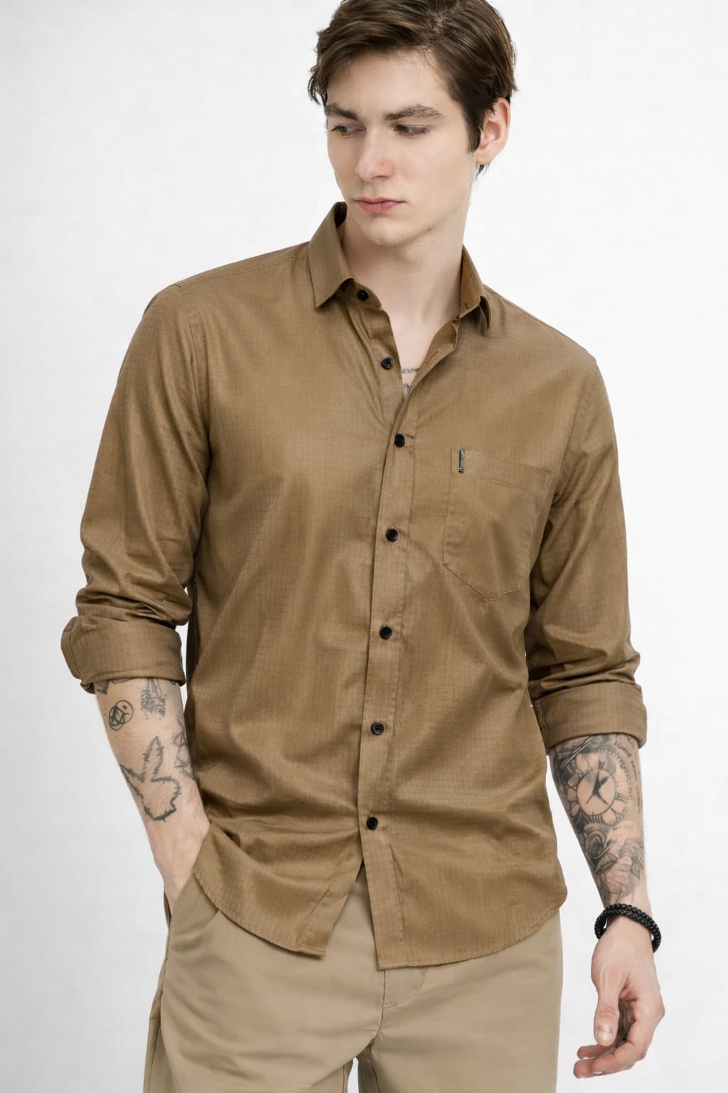 Man wearing a brown shirt with a white background
