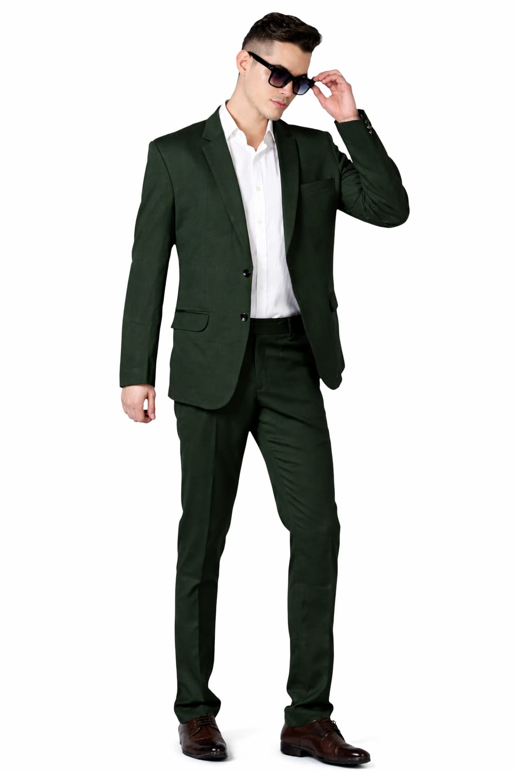 Man wearing a green suit and sunglasses on a white background