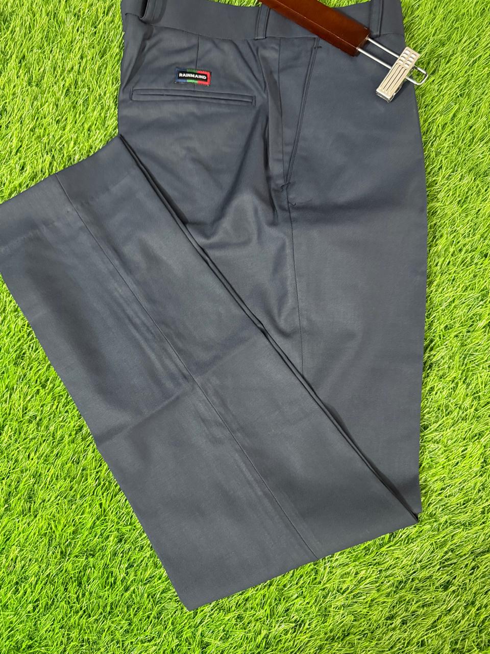 Gray pants on a green grass background