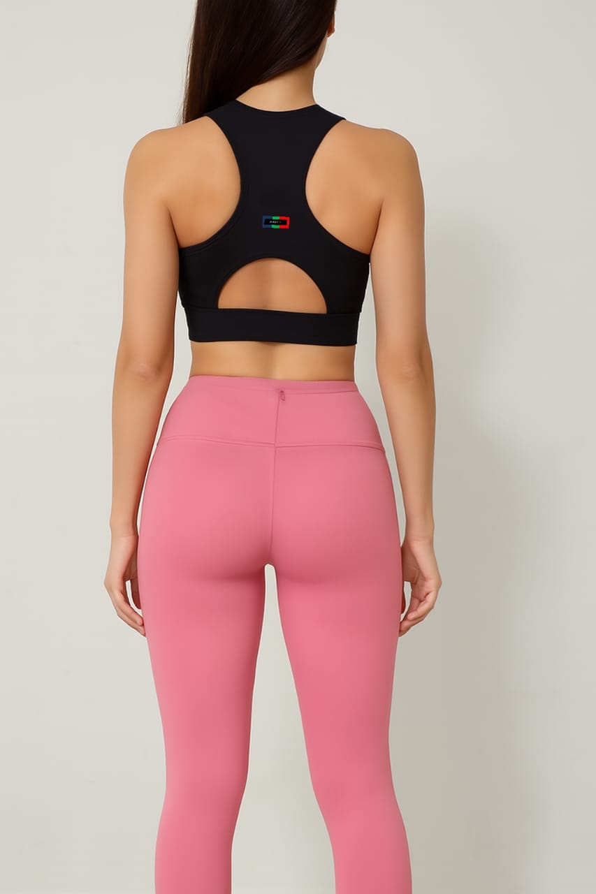 Man wearing a red checkered shirt with a small logo on a gray background