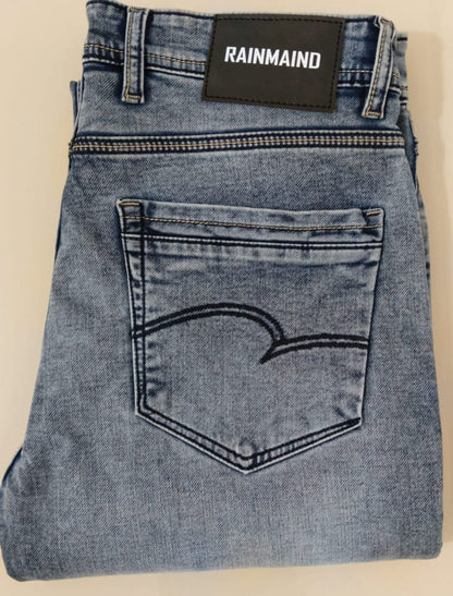 Blue jeans with a 'Rainmaid' label on a beige background