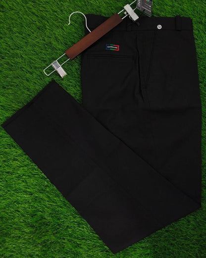 Black pants with a belt on a green grass-like surface