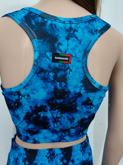 Blue tie-dye tank top with a visible brand label on a plain background