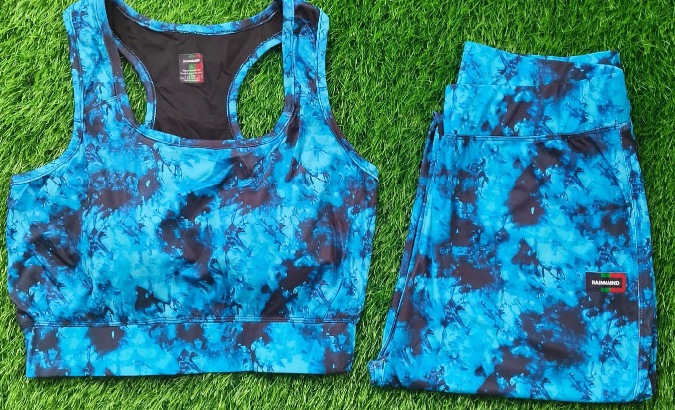 Blue camouflage sports bra and leggings set on grass