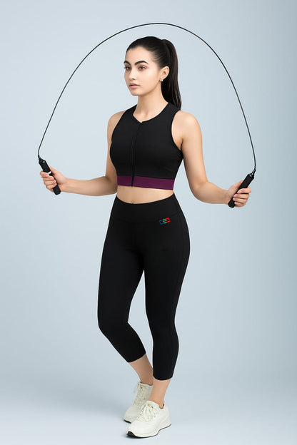 Woman holding a jump rope against a light gray background