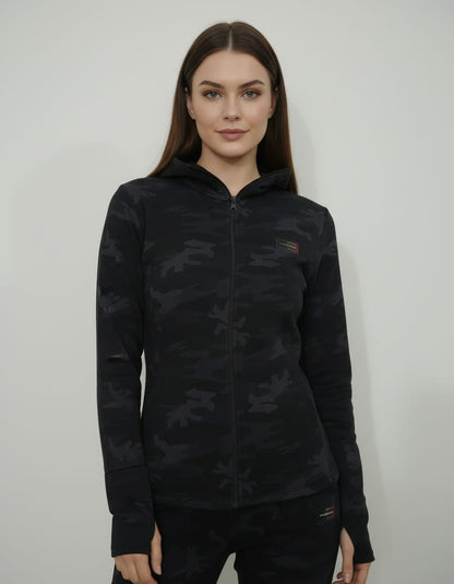 Woman wearing a black camouflage jacket with a brand logo on a white background