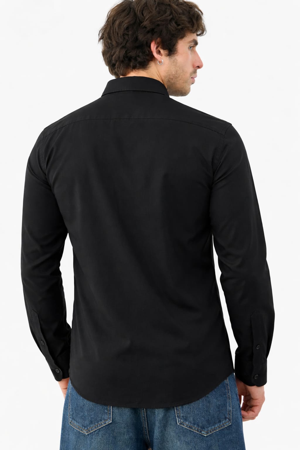 Man wearing a black long-sleeve shirt with a plain background