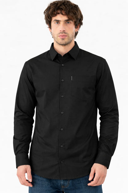Man wearing a black button-up shirt on a white background