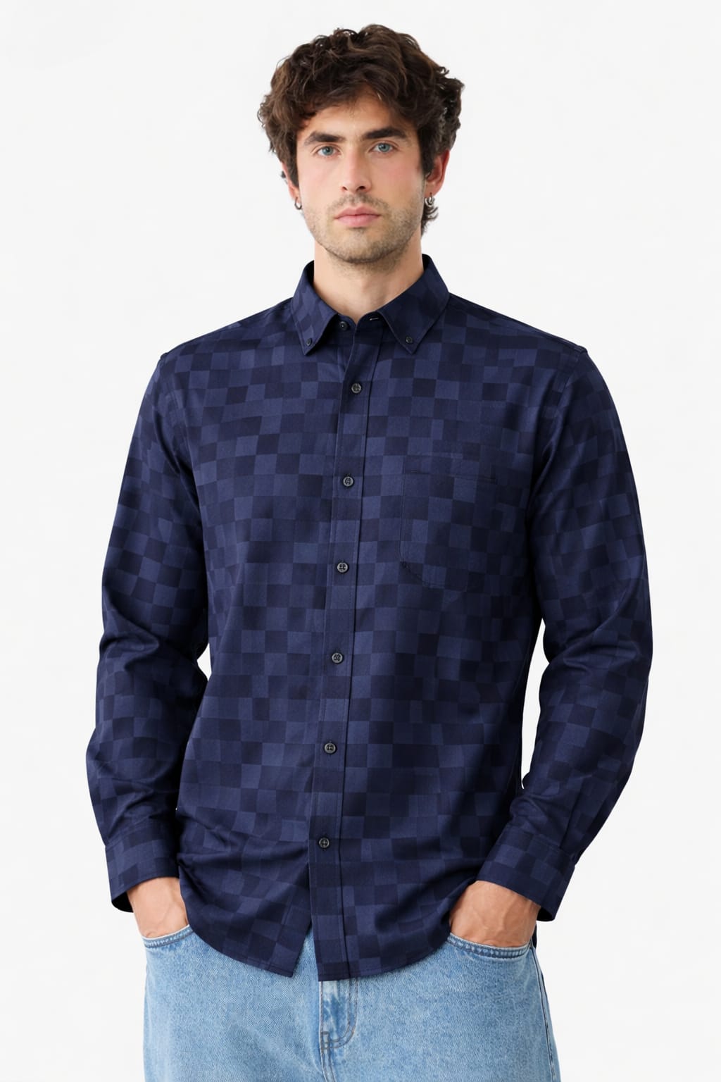 Man wearing a dark blue checkered shirt against a white background