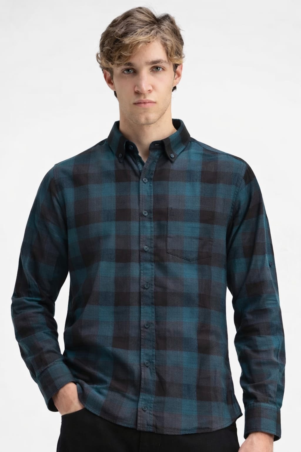 Man wearing a blue and black plaid shirt on a white background