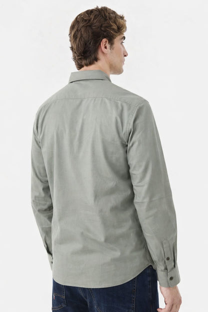 Man wearing a light gray shirt on a white background