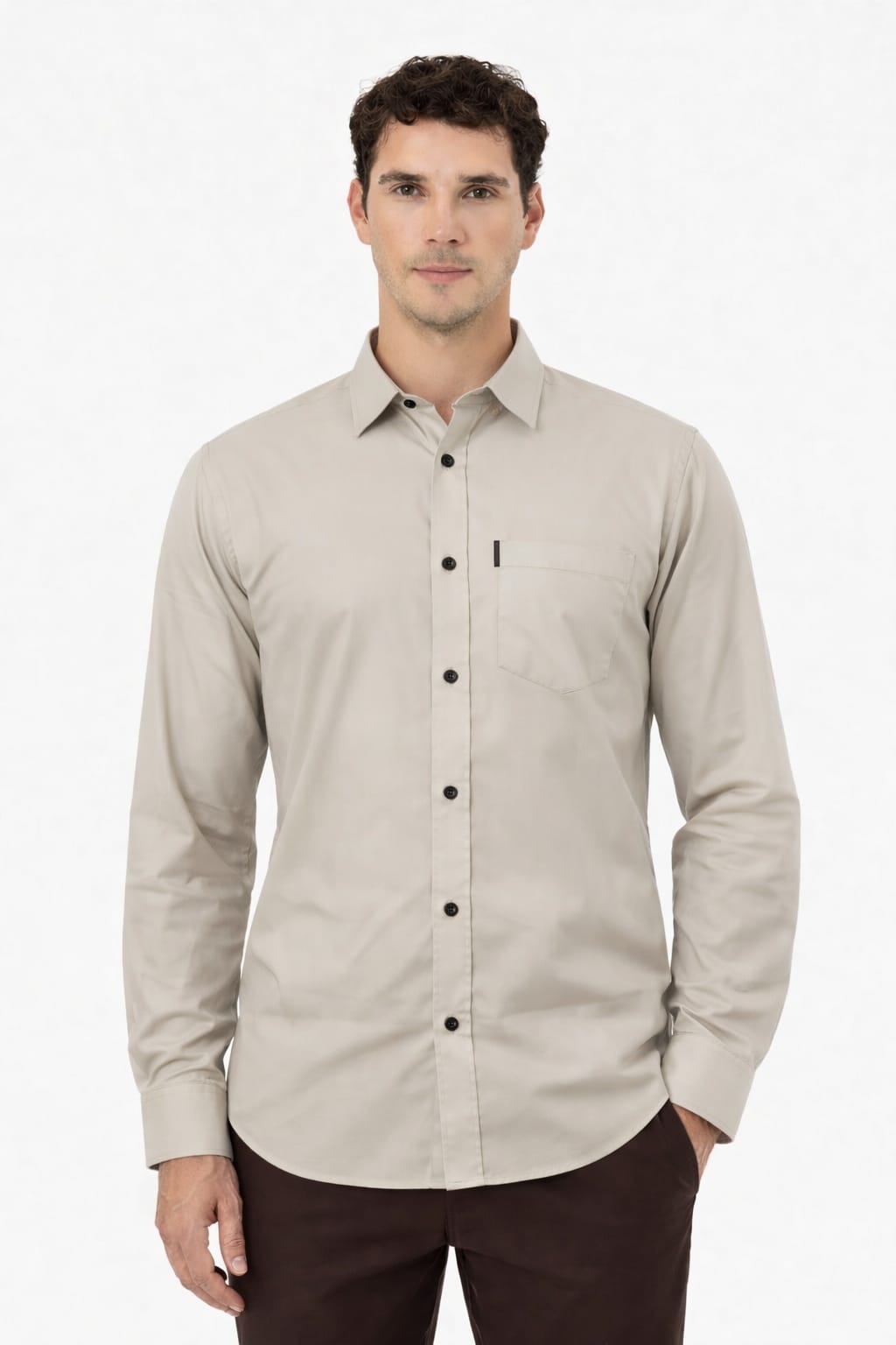Man wearing a beige button-up shirt on a white background