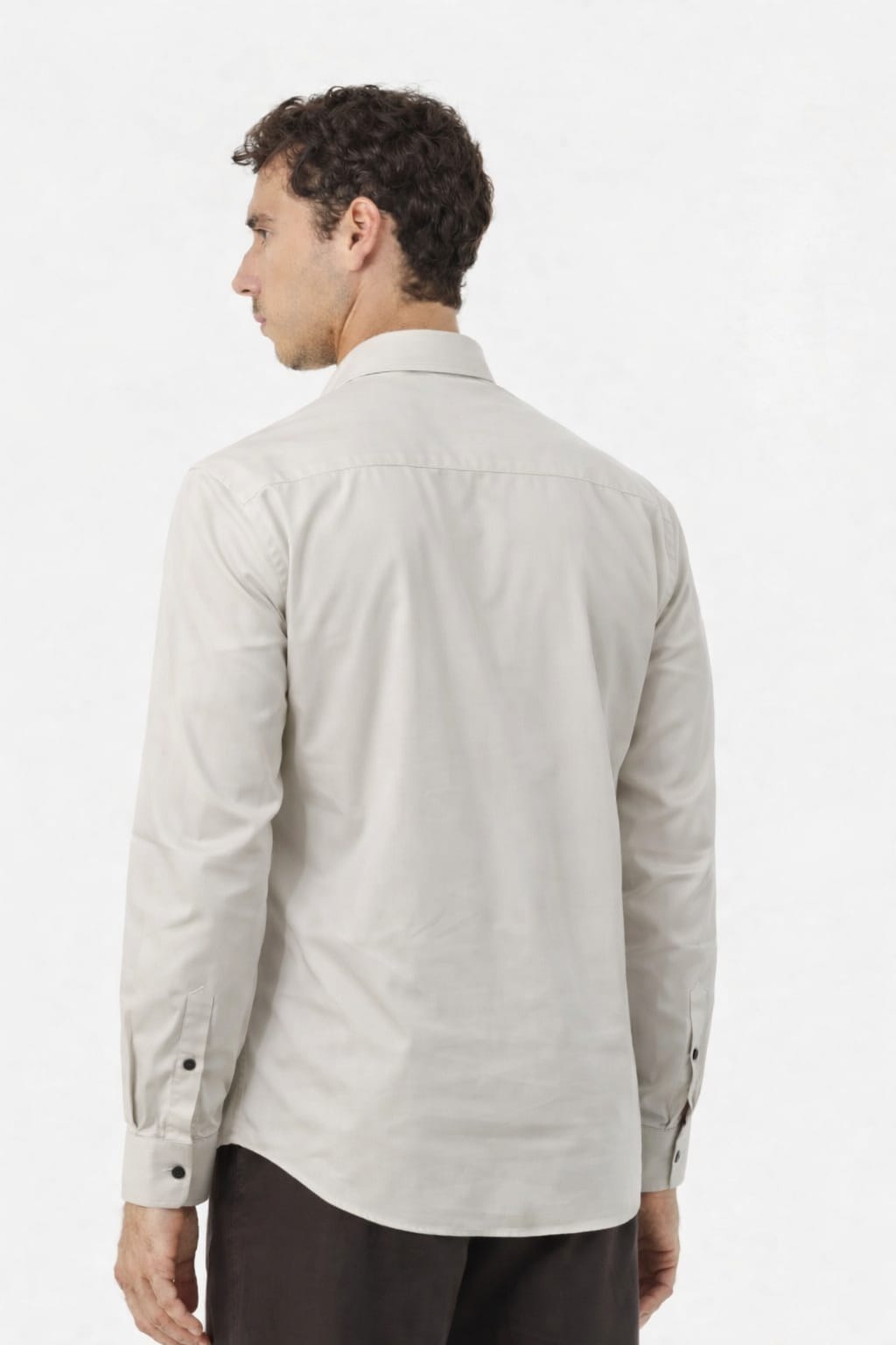 Man wearing a light gray shirt on a white background