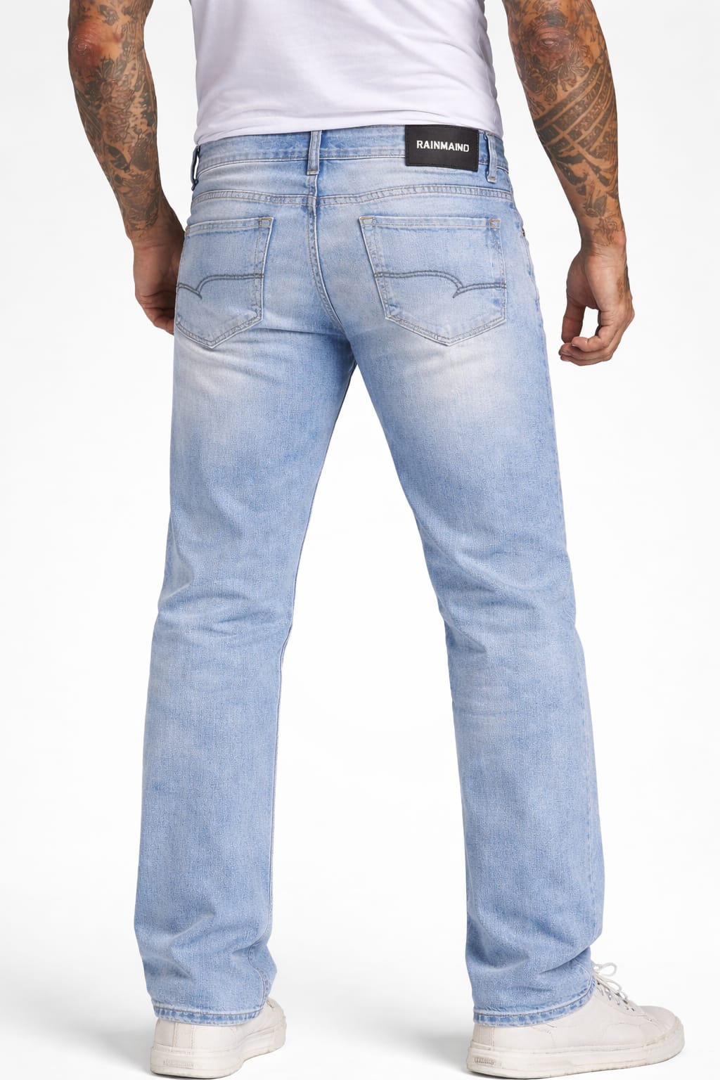 Light blue jeans worn by a person on a white background