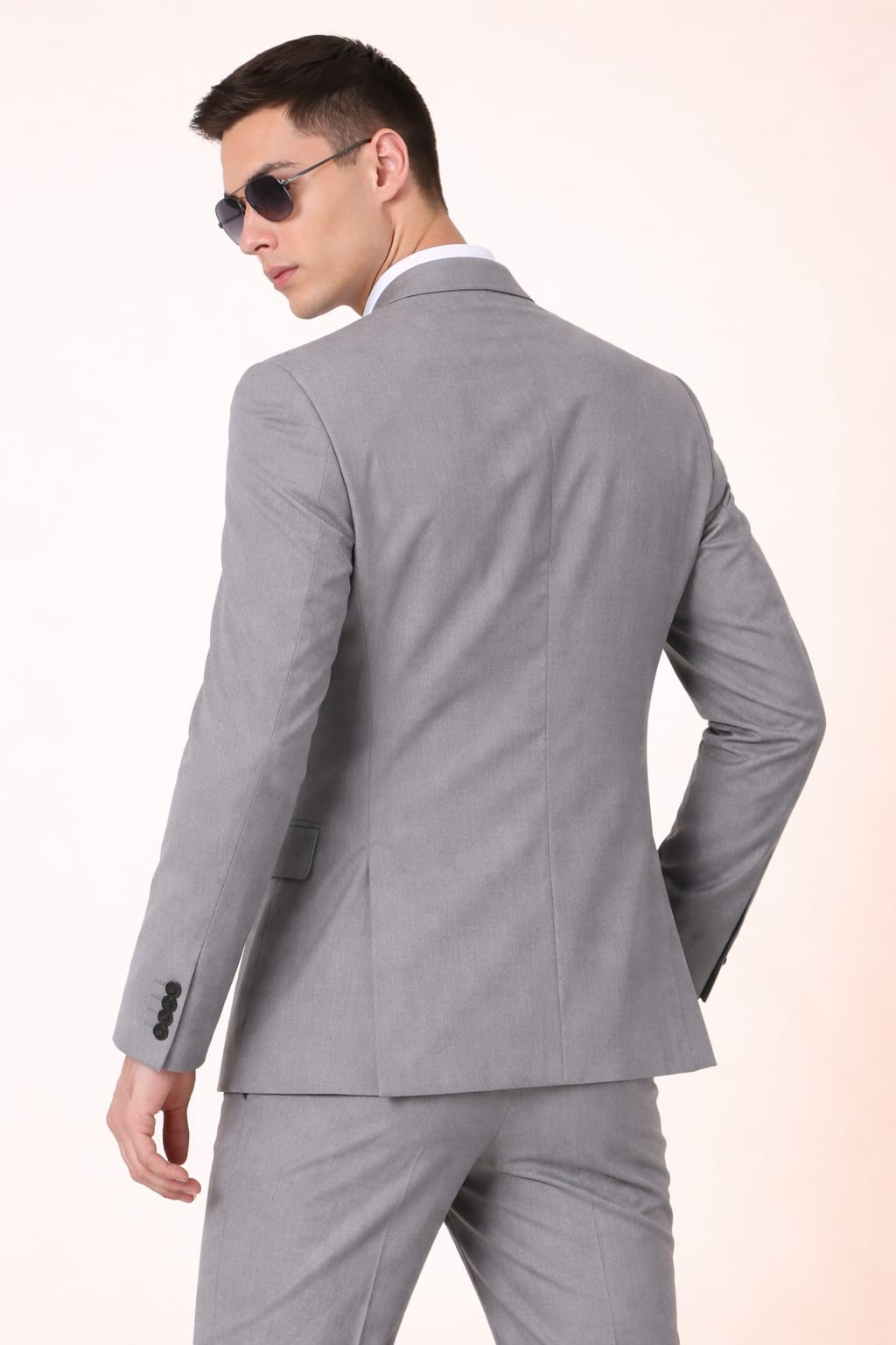 Man wearing a gray suit on a white background