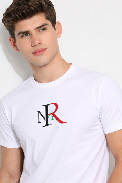 Man wearing a white t-shirt with a logo on a plain background