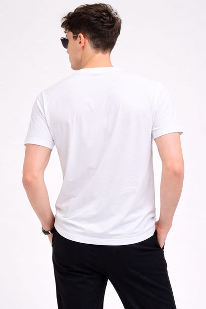 Man wearing a white t-shirt and black pants on a white background