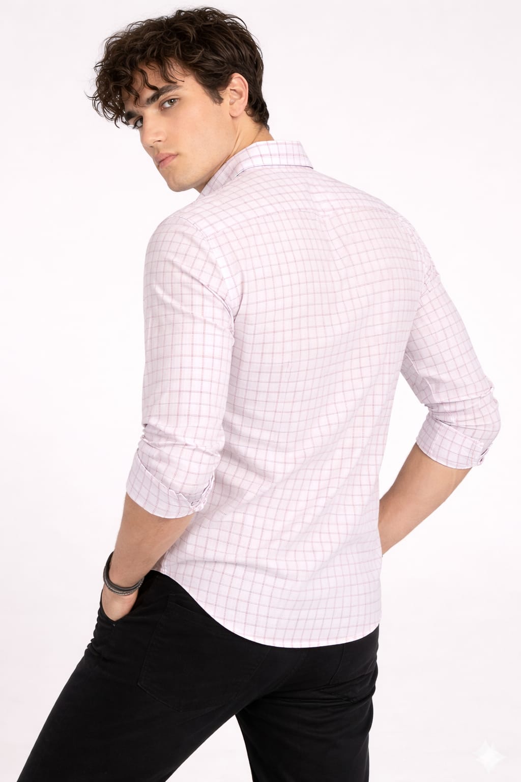 Man wearing a white checkered shirt with a gray background