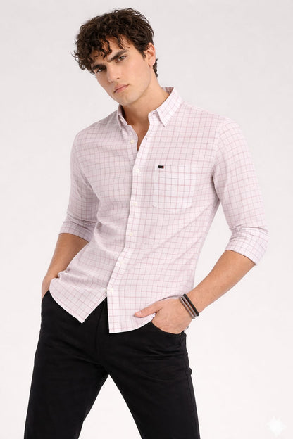Man wearing a white checkered shirt with rolled-up sleeves on a white background