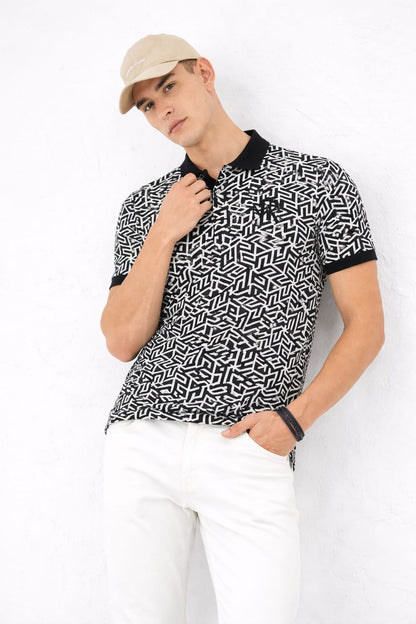 Man wearing a black and white patterned shirt with a beige cap on a white background